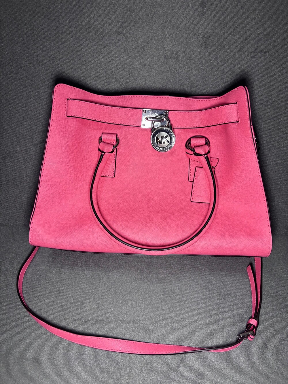 Michael Kors Pink Leather Handbag with Lock Charm and Adjustable Strap